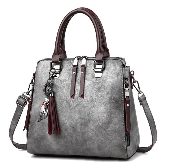 Sac à main structuré – Charms fantaisie et élégance urbaine