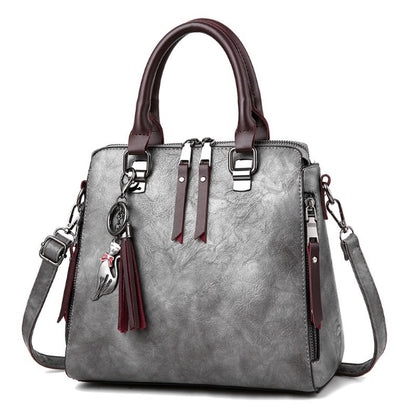 Sac à main structuré – Charms fantaisie et élégance urbaine